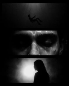 the silhouette of a person standing in front of a dark background with light coming from behind them