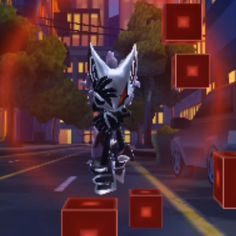 a cat riding on the back of a motorcycle in front of some red cubes