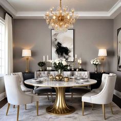 a dining room table with white chairs and chandelier