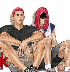 two people sitting next to each other on the ground