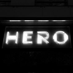 a neon sign that says hero on it