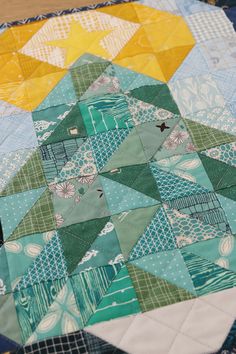 a close up of a quilt on a table