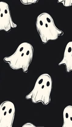 black and white ghost faces on a black background for halloween wallpaper or backdrops