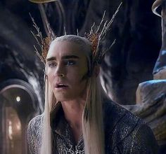 a woman with long blonde hair and blue eyes in a scene from game of thrones