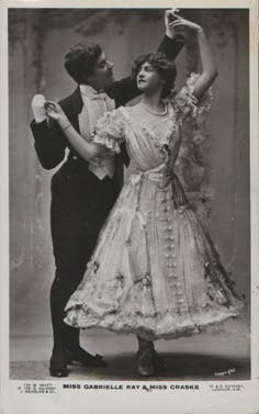 an old photo of a man and woman dancing