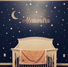 Nursery with moon and stars background with a name decal
