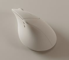 a white computer mouse sitting on top of a table