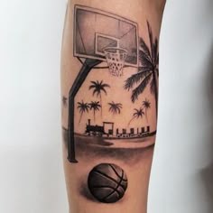 a man's arm with a basketball and palm trees on it
