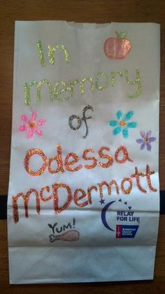 a piece of paper that has been decorated with words and glitters on the side