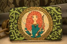 Merida from Brave - a cookie I made for my grand daughter Bella- Fine Arts Bakery Brave Cookies, Merida Brave Food, Brave Pastries, Brave Desserts, Pocahontas Cookies, Brave Movie Cookies, Merida Brave Cake Ideas, Brave Movie Dessert, Gingerbrave Cookie
