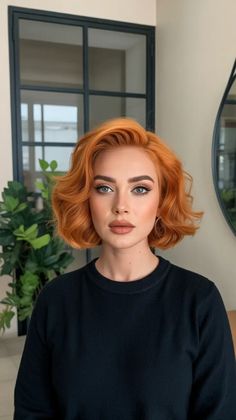 In this case, the cut falls into gentle, chin-to-collarbone bob with wavery waves which fly off the face, thereby providing that fresh, almost retro glamour. The ginger hair colors story remains the same as the Copper, however, a bit warmer and less serious, with a bit of dimension making the surface not appear flat. Ginger Hair Short, Short Ginger Hair, Copper Bob With Bangs, Short Copper Bob, Bob Ginger Hair, Ginger Bob, Fiery Redhead, Ginger Hair Color, Romantic Curls