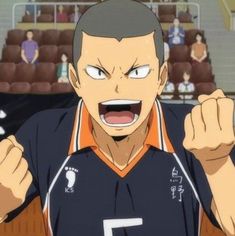 an anime character with his fist up in front of the camera and people behind him