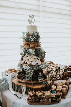a table topped with lots of desserts and cookies