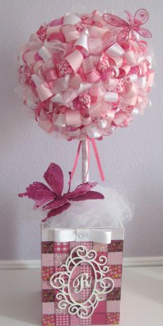 a vase filled with lots of pink and white candies