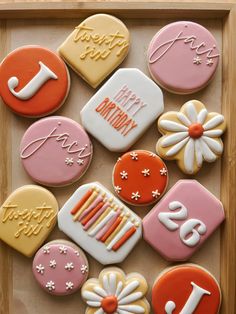 decorated cookies in a box with happy birthday written on them