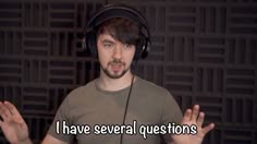 a man wearing headphones with the words i have several questions in front of him