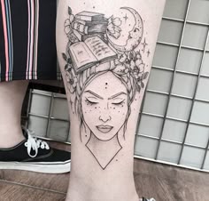 a woman's leg with a tattoo on it