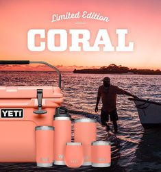 a man standing in the water next to an orange cooler and four smaller yeti cups