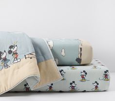 mickey mouse bedding set with matching sheets and pillowcases on white table top