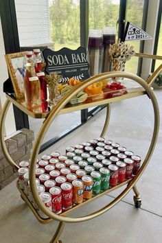 a bar cart filled with sodas and drinks