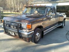 a brown truck parked in front of a house