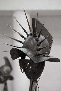 a helmet with spikes on it sitting on top of a table