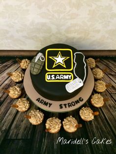 a decorated army cake with cupcakes in the shape of an army boot and stars