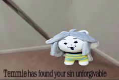 there is a stuffed animal on the stairs