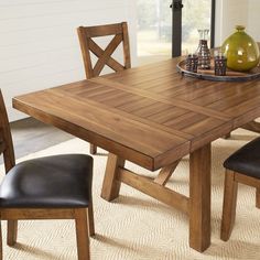 a dining room table with chairs and a plate on it