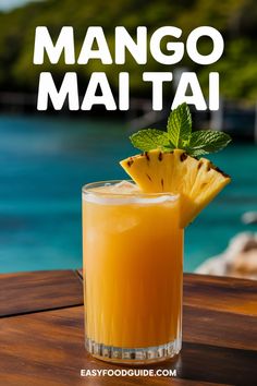 an orange drink sitting on top of a wooden table next to the ocean with text overlay