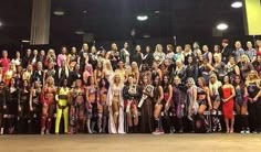 a large group of people posing for a photo