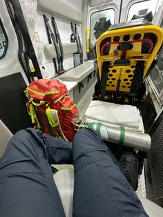 a person's legs resting on the seat of a bus