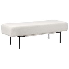 a white bench sitting on top of a metal frame