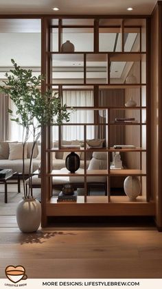 a living room filled with furniture and a plant