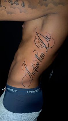 a man's stomach with his name tattooed on the side and words written in cursive writing