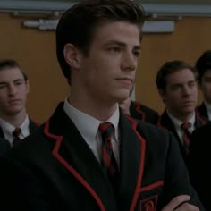 a group of young men wearing suits and ties