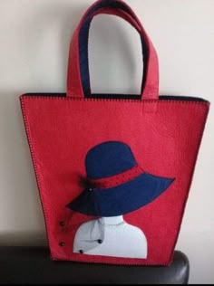 a red bag with a blue hat on it