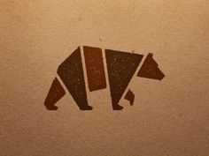 a bear logo is shown on a brown paper
