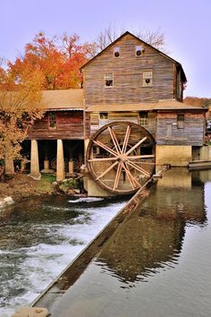 an old mill with water running through it