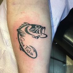 a man with a tattoo on his arm has a fish and the words i can't wait