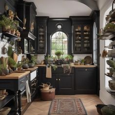 a kitchen filled with lots of pots and pans on top of wooden shelves next to a window