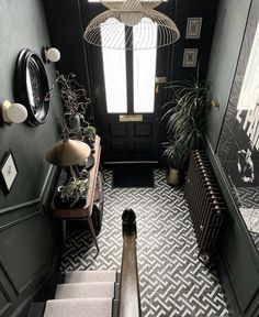 the stairs in this house are decorated with black and white tiles