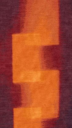 an orange and red area rug with squares on the bottom, in shades of purple and yellow