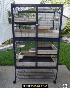 a large bird cage with three levels on the top and two levels on the bottom