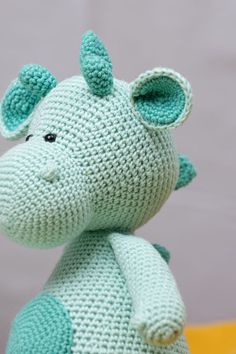 a crocheted stuffed animal sitting on top of a table