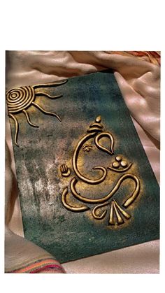 an intricately decorated book on a bed