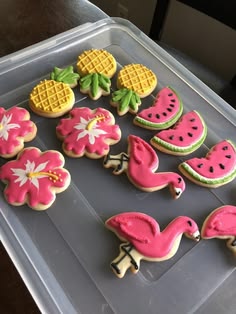 decorated cookies in the shape of flamingos, watermelon and pineapples