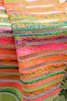 a multicolored blanket sitting on top of a table
