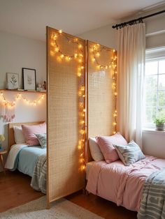 a bedroom with two beds and lights on the wall