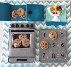 there are cookies and pies on top of the table next to an appliance